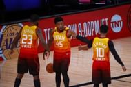 Royce O'Neale, Donovan Mitchell and Mike Conley of the Utah Jazz